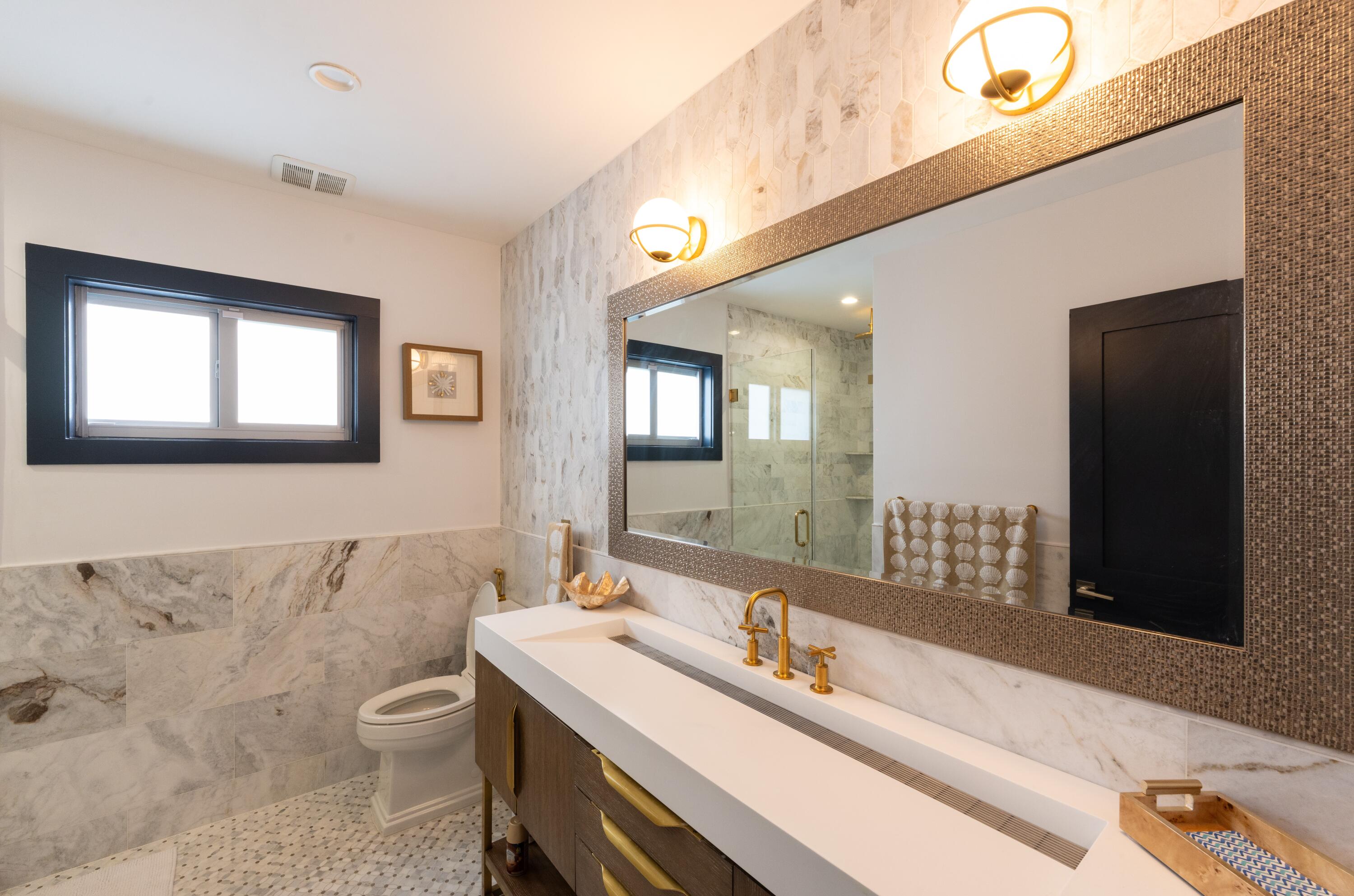 475 Bahia Honda Road Key Largo, FL 33037 - Photo 98 of 134 a bathroom with a granite countertop sink mirror and a toilet