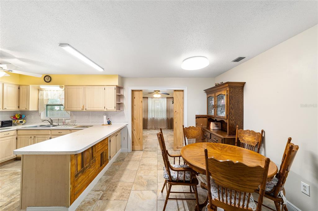 11 Brook Place Ocala, FL 34472 - Photo 11 of 27 a large kitchen with a table and chairs