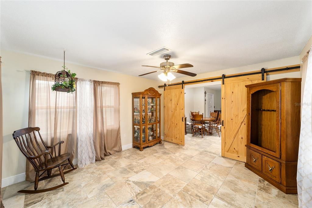 11 Brook Place Ocala, FL 34472 - Photo 15 of 27 a view of a livingroom with furniture and a ceiling fan