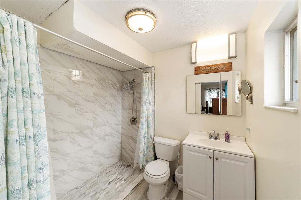 11 Brook Place Ocala, FL 34472 - Photo 19 of 27 a bathroom with a sink a toilet and shower