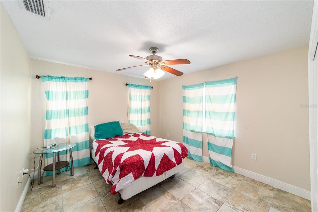 11 Brook Place Ocala, FL 34472 - Photo 20 of 27 a bedroom with a bed and a window