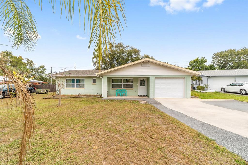 11 Brook Place Ocala, FL 34472 - Photo 2 of 27 a view of a house with a swimming pool and sitting area