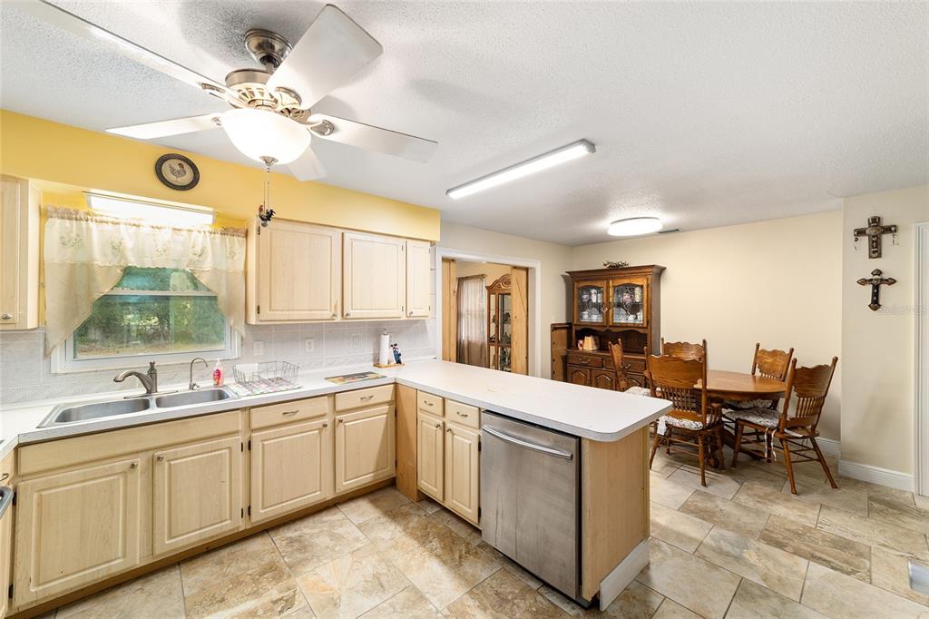 11 Brook Place Ocala, FL 34472 - Photo 9 of 27 a large white kitchen with a window