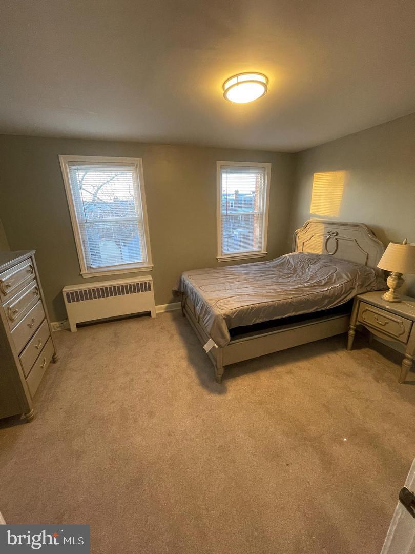 3654 Clarenell Road Baltimore, MD 21229 - Photo 11 of 15 a bedroom with a bed and a window