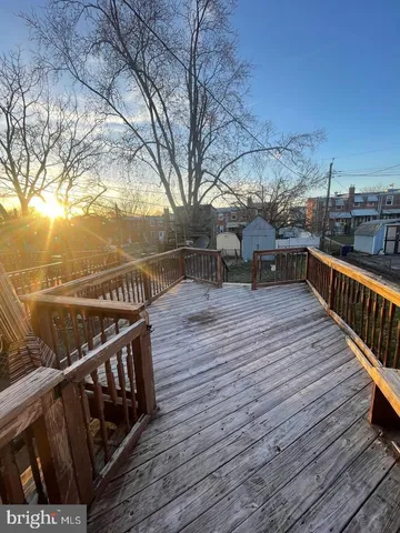 a view of deck with wooden floor and seating space
