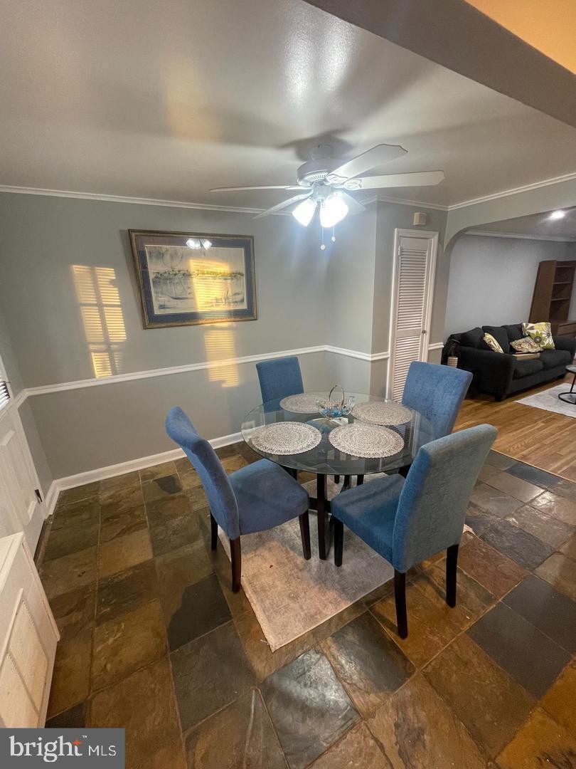 3654 Clarenell Road Baltimore, MD 21229 - Photo 8 of 15 a living room with furniture and chandelier