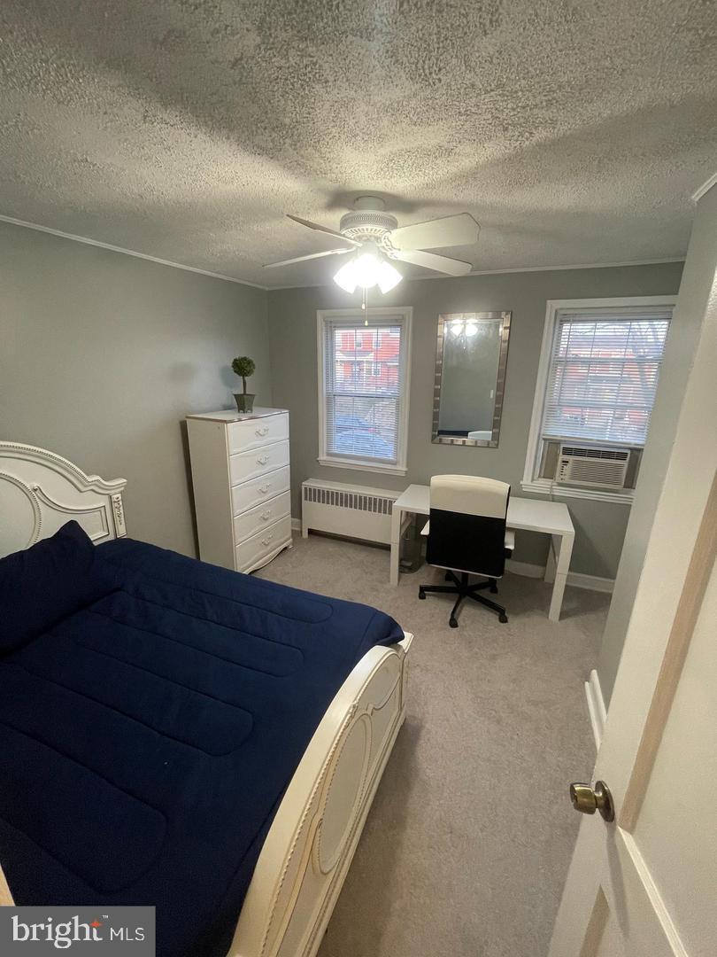 3654 Clarenell Road Baltimore, MD 21229 - Photo 9 of 15 a living room with furniture and a wooden floor