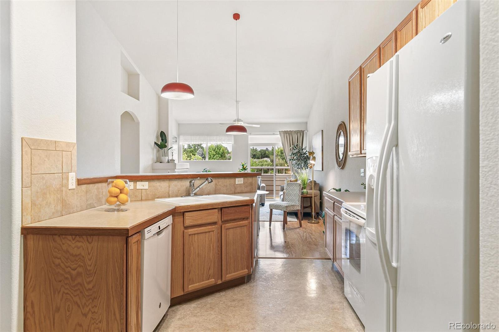 6577 South Reed Way, Unit B Littleton, CO 80123 - Photo 11 of 46 a kitchen with a sink and cabinets