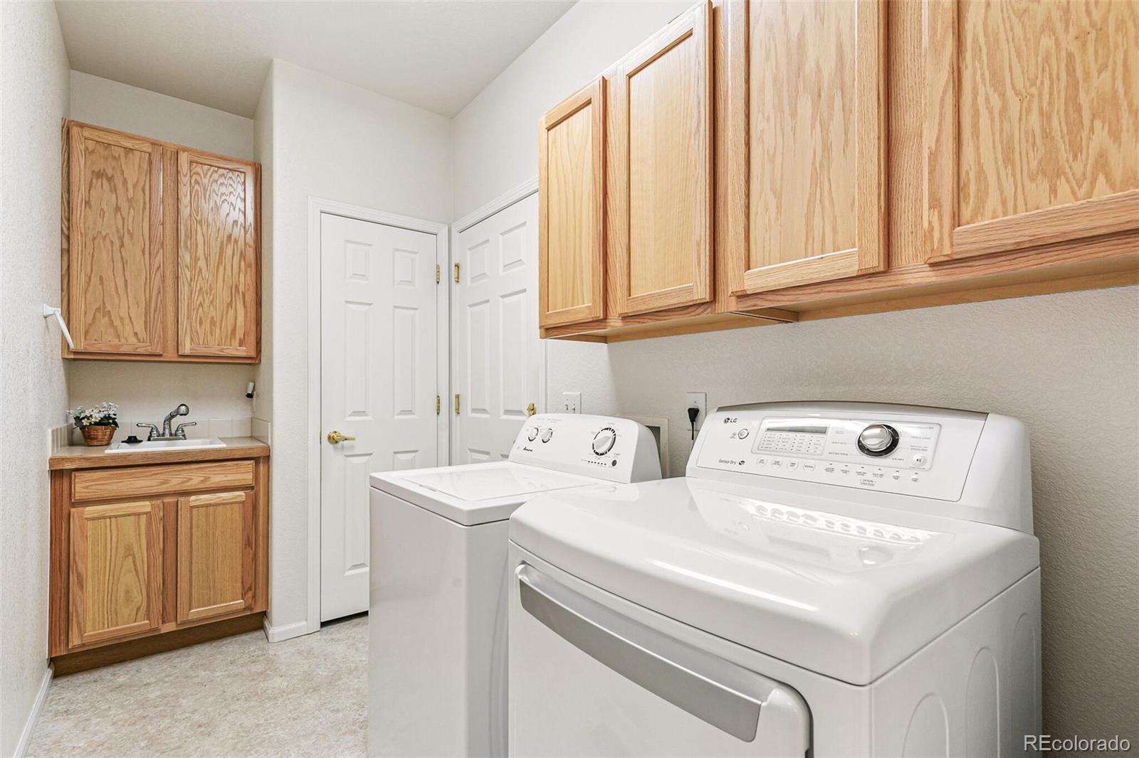 6577 South Reed Way, Unit B Littleton, CO 80123 - Photo 32 of 46 a utility room with dryer and washer