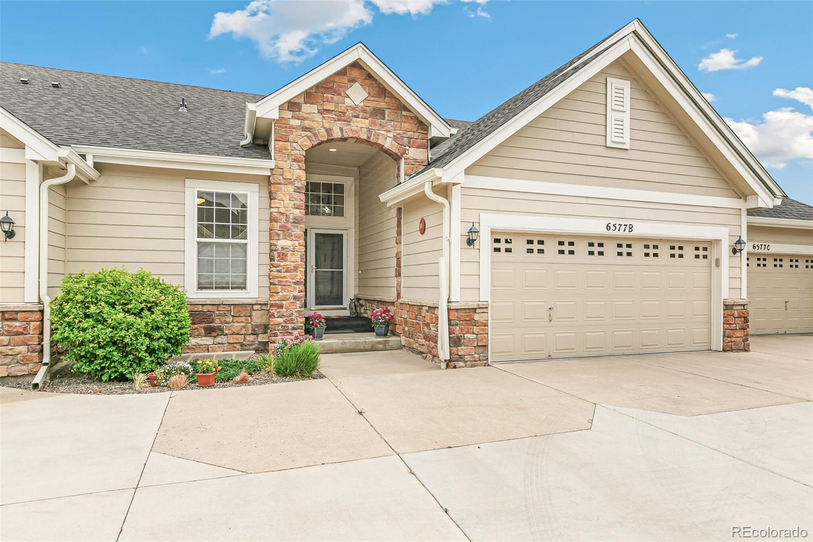 6577 South Reed Way, Unit B Littleton, CO 80123 - Photo 36 of 46 a view of a house with large windows