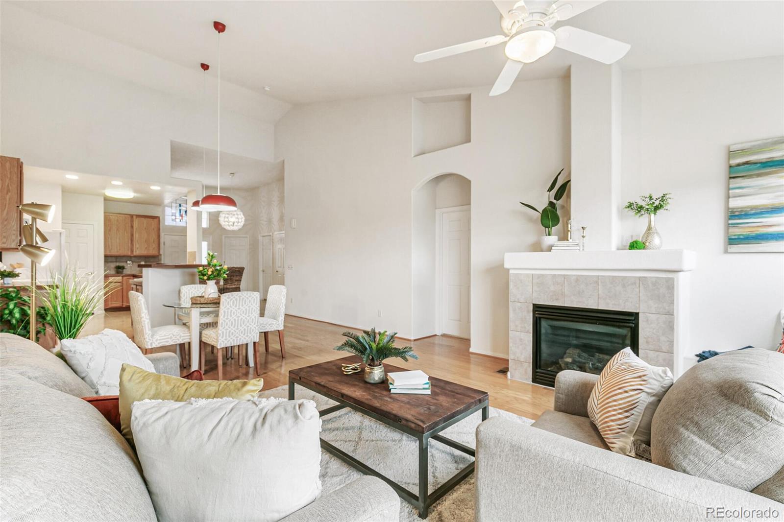 6577 South Reed Way, Unit B Littleton, CO 80123 - Photo 6 of 46 a living room with furniture and a fireplace