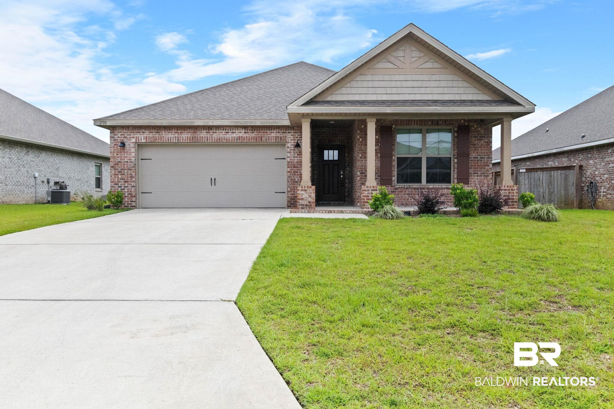 1710 Grouse Street Foley, AL 36535 - Photo 1 of 76 Brick veneer exterior with a covered porch entry