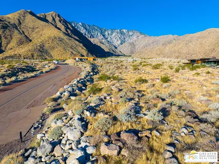 an aerial view of residential building and ocean view