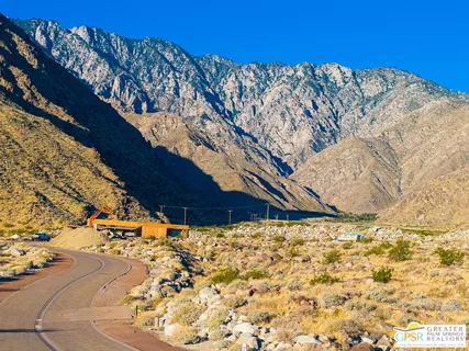 a view of mountain with sunset