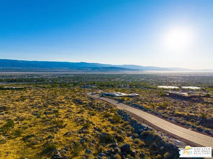 a view of a backyard of the house