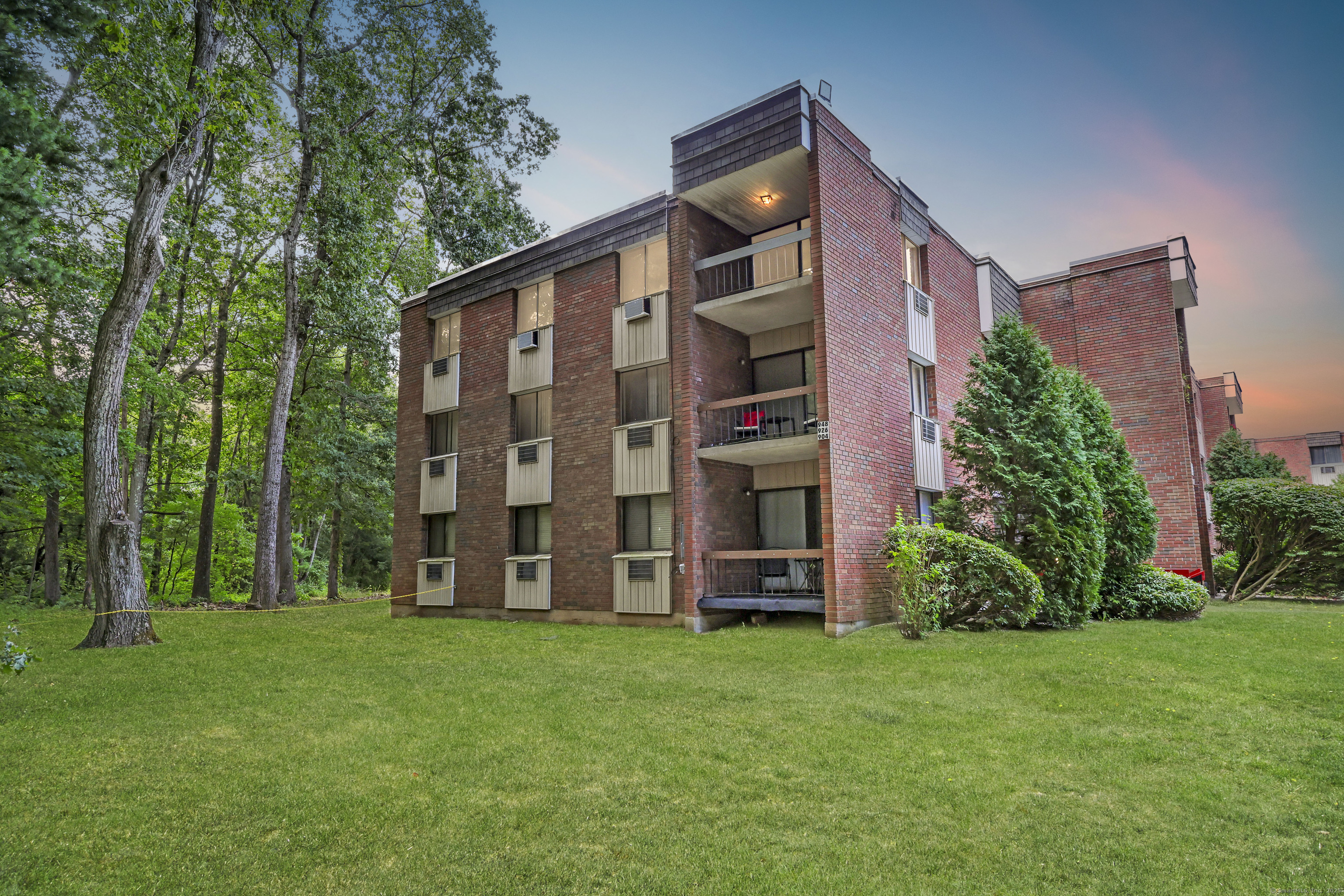 two front view of a house with garden