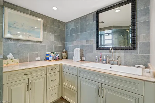 a kitchen with a sink and cabinets