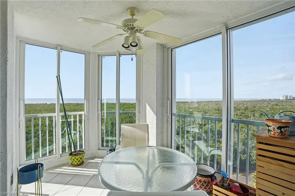 a bedroom with a bed and glass window