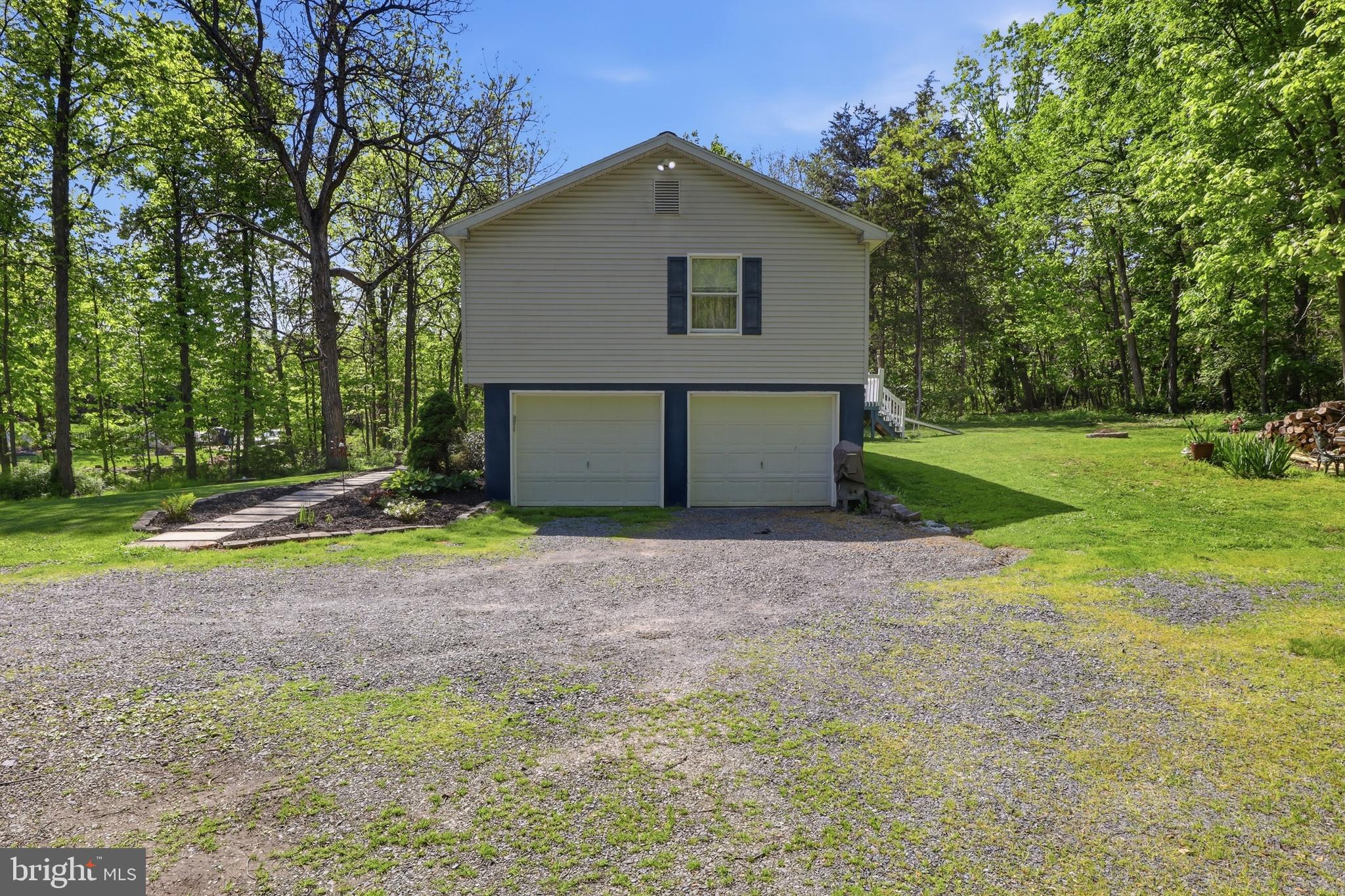 162 Jackson Road Gettysburg, PA 17325 - Photo 6 of 37 a front view of a house with a yard and garage
