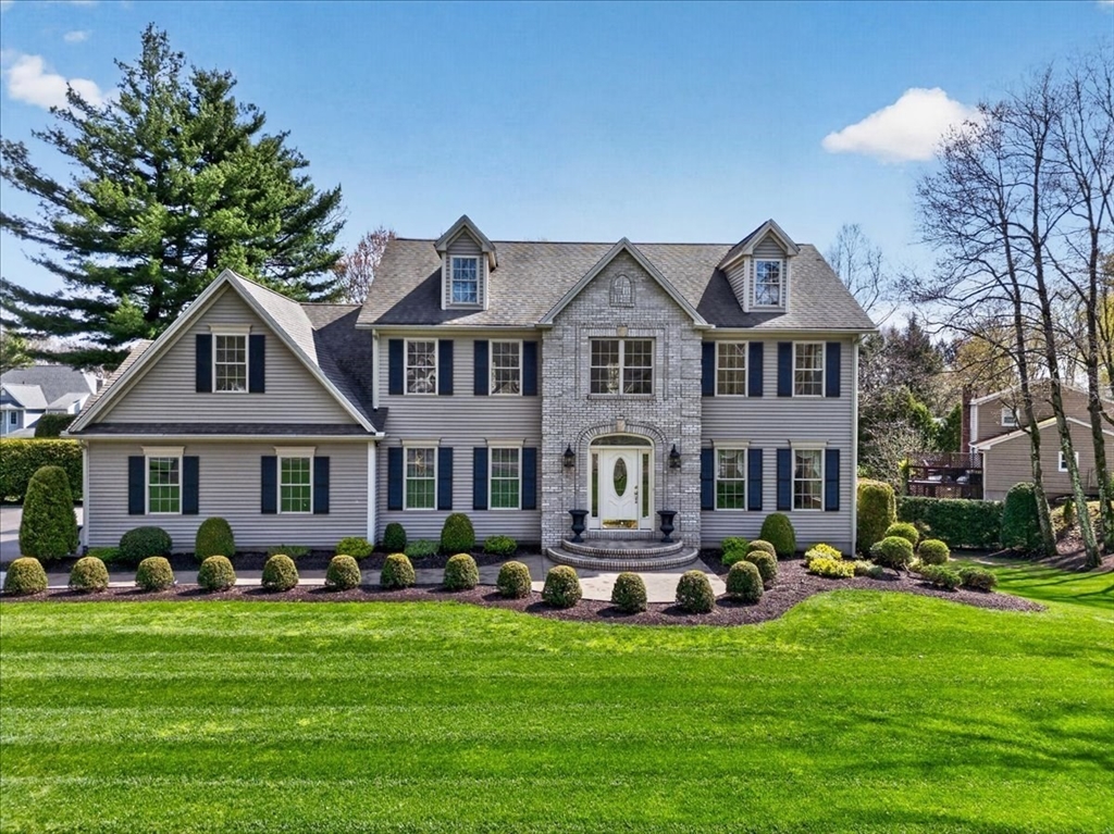 1318 Piper Road West Springfield, MA 01089 - Photo 2 of 42 a front view of a house with a garden and trees
