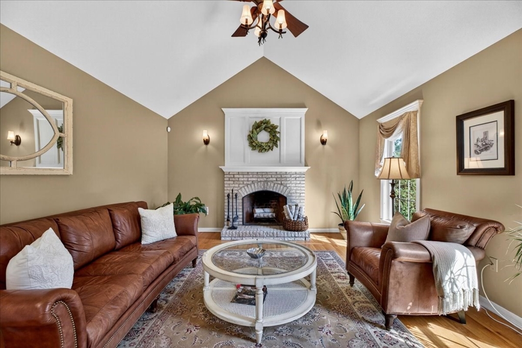 1318 Piper Road West Springfield, MA 01089 - Photo 21 of 42 a living room with furniture a fireplace and a chandelier