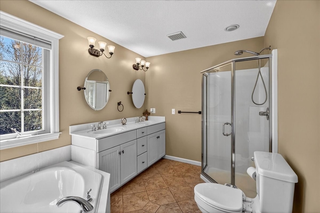 1318 Piper Road West Springfield, MA 01089 - Photo 29 of 42 a bathroom with a double vanity sink toilet mirror and shower