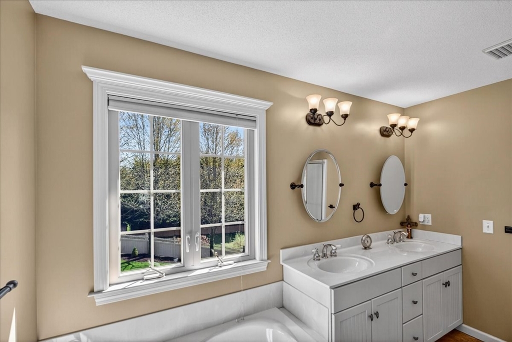 1318 Piper Road West Springfield, MA 01089 - Photo 30 of 42 a bathroom with a sink and a mirror
