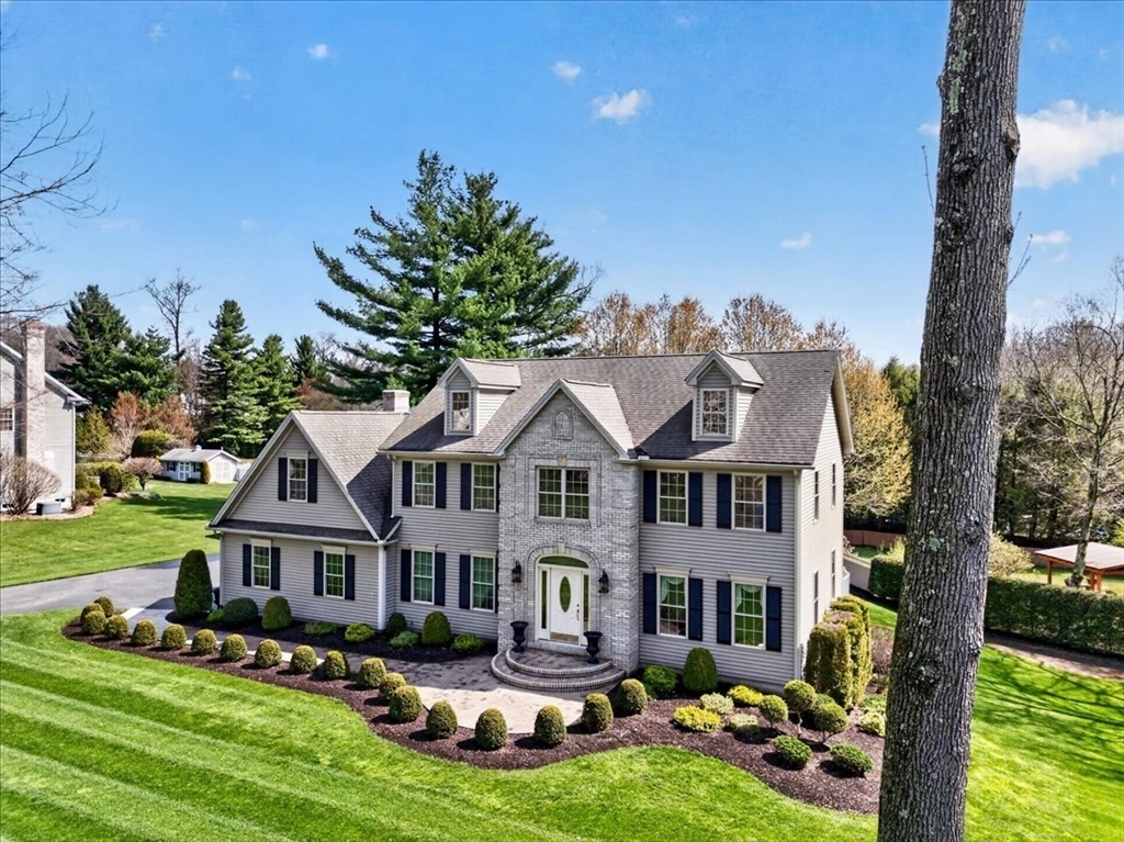 1318 Piper Road West Springfield, MA 01089 - Photo 3 of 42 a front view of a house with garden and trees
