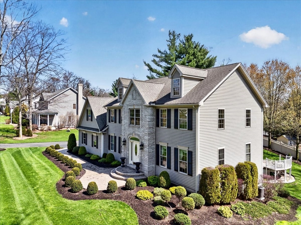 1318 Piper Road West Springfield, MA 01089 - Photo 9 of 42 a view of a white house with a big yard and potted plants