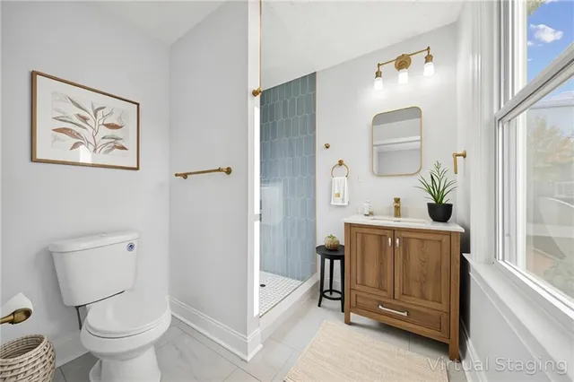 a bathroom with a bathtub shower sink mirror and toilet