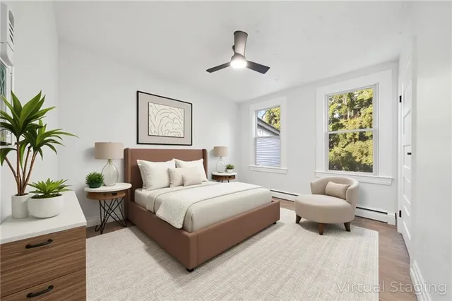 a bedroom with a bed and ceiling fan