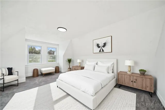 a bedroom with a bed and a couch