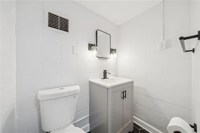 a bathroom with a toilet and shower