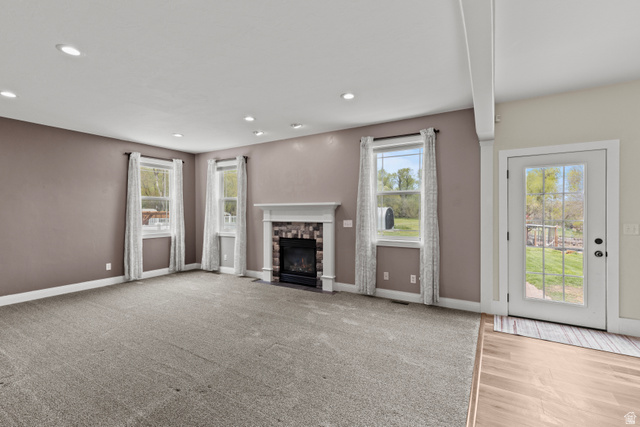 75 East 200 North Mendon, UT 84325 - Photo 34 of 36 Unfurnished living room featuring a fireplace, recessed lighting, and light carpet