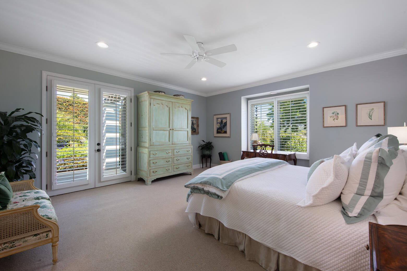 1975 Inverness Lane Montecito, CA 93108 - Photo 17 of 22 a spacious bedroom with a bed a chandelier and large window
