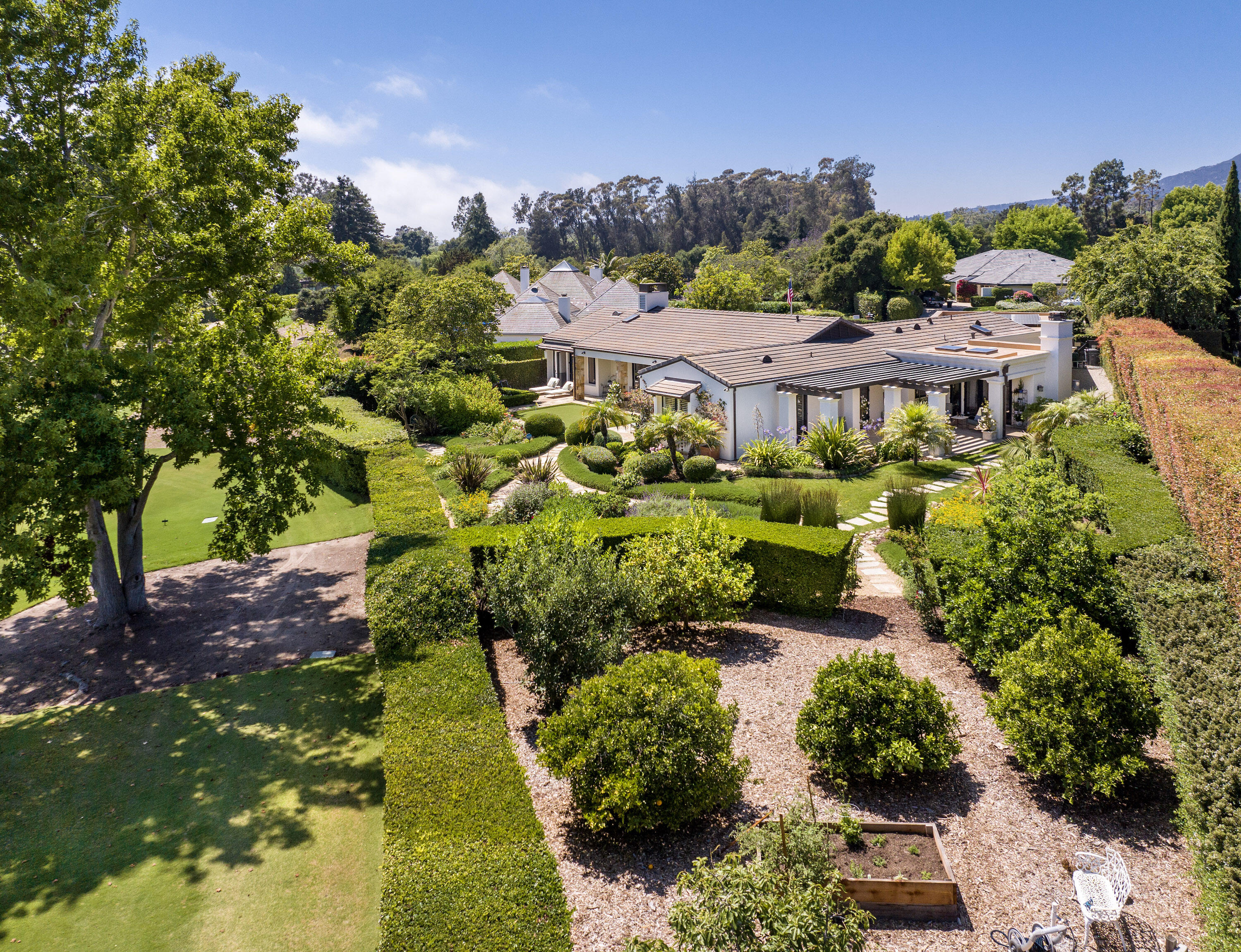 1975 Inverness Lane Montecito, CA 93108 - Photo 20 of 22 a view of a house with a garden