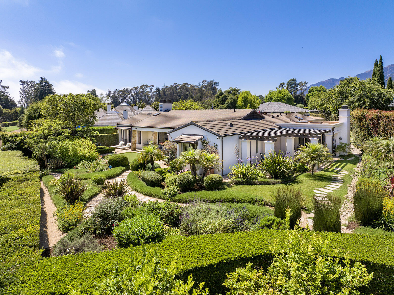 1975 Inverness Lane Montecito, CA 93108 - Photo 7 of 22 a front view of a house with a yard