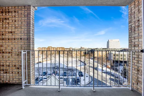 a view of a balcony with city view