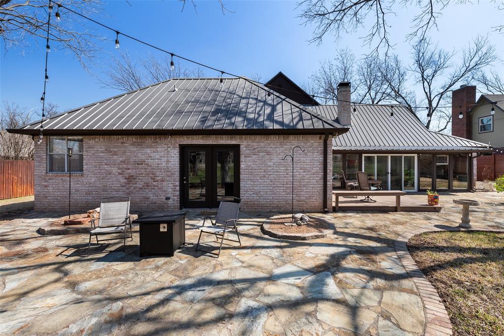 8903 Ravenswood Road Granbury, TX 76049 - Photo 33 of 36 Large Flagstone Patio Easily Accessed From The Primary Bedroom