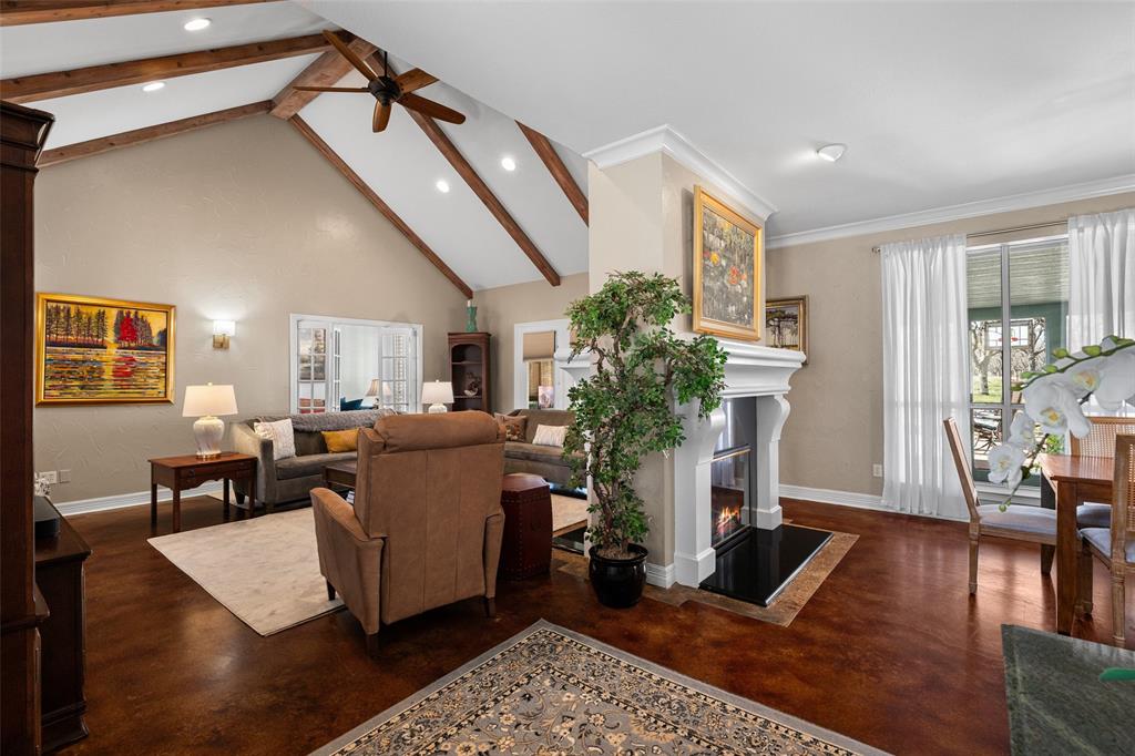 8903 Ravenswood Road Granbury, TX 76049 - Photo 5 of 36 Living & Dining Divided By A Double Sided Fireplace