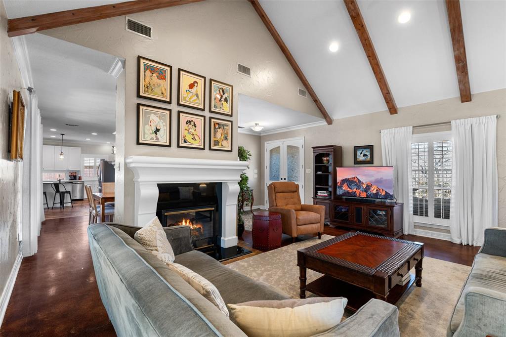 8903 Ravenswood Road Granbury, TX 76049 - Photo 6 of 36 A Cozy Gas Fireplace Anchors The Living Area