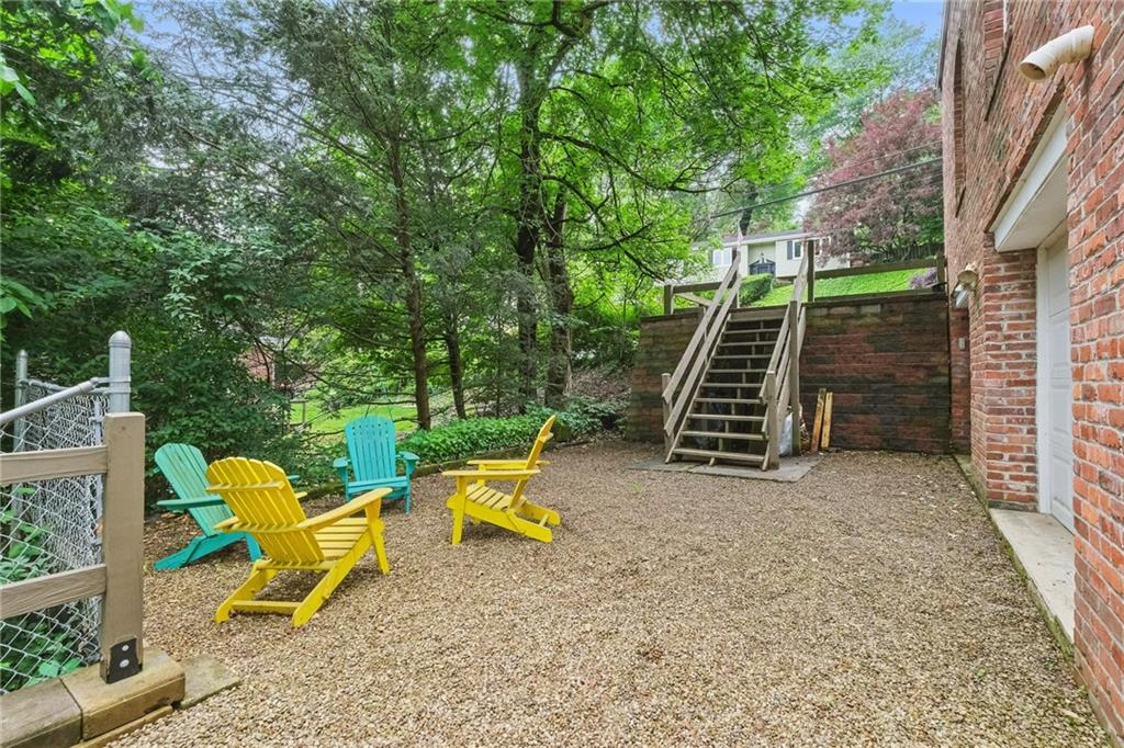 127 Fairfax Road Pittsburgh, PA 15221 - Photo 33 of 41 Picture from Spring 2025 listing - great area for a firepit outside the garages which are used for storage