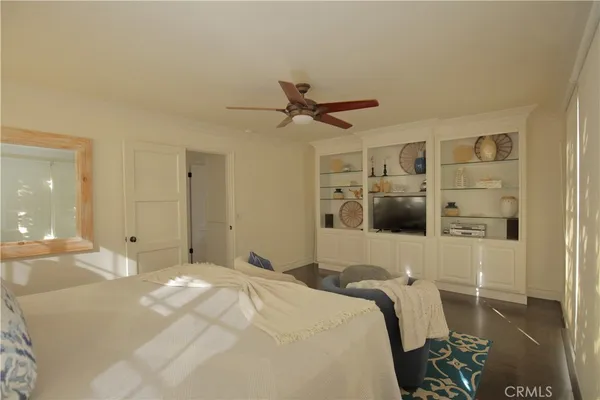 a view of a patio with couches table and chairs and potted plants