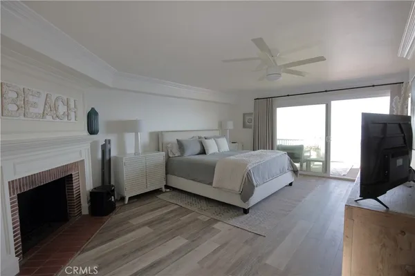 a spacious bedroom with a bed and a fireplace