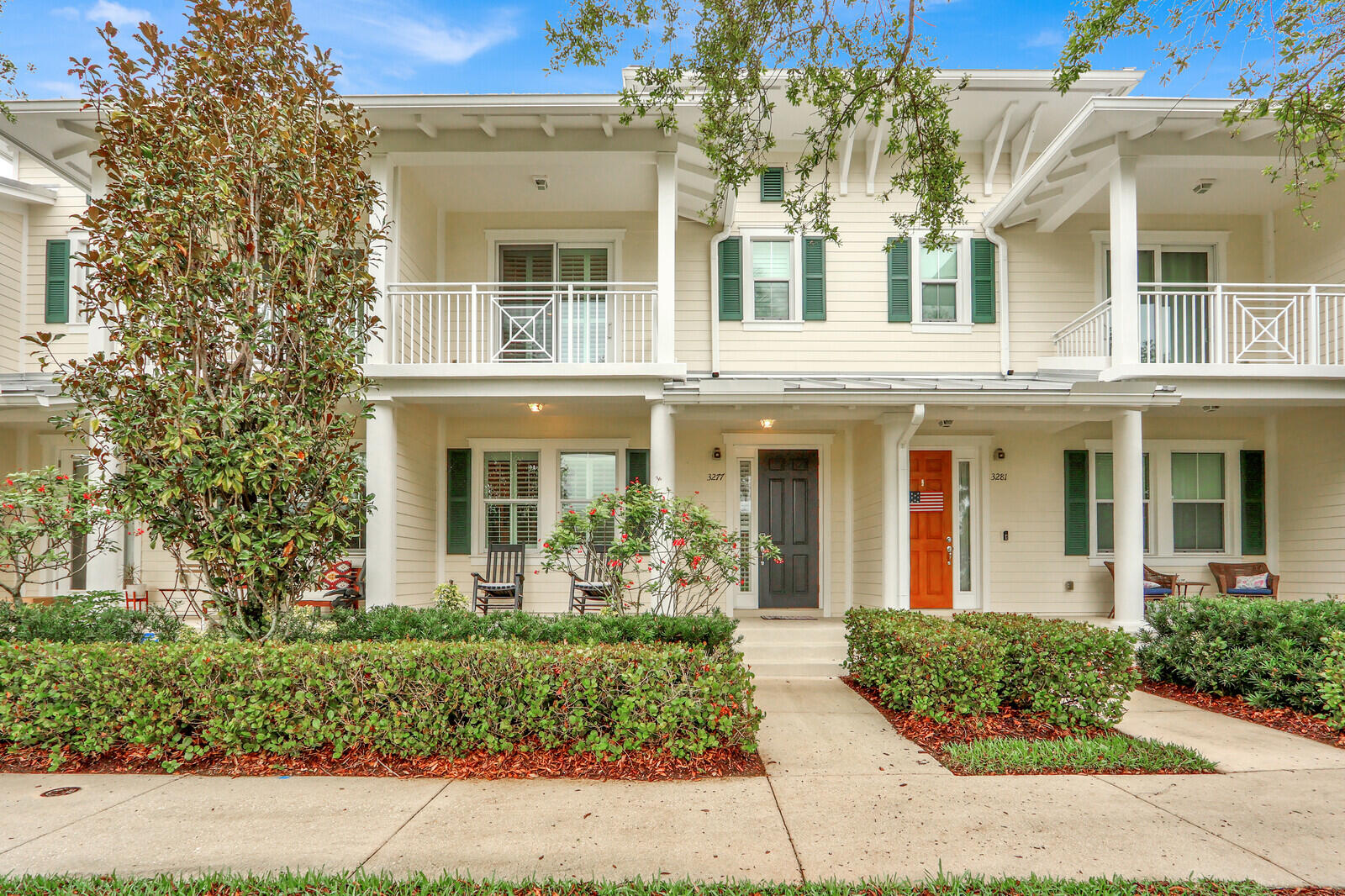 3277 East Mallory Boulevard Jupiter, FL 33458 - Photo 1 of 44 front view of a brick house with a large windows