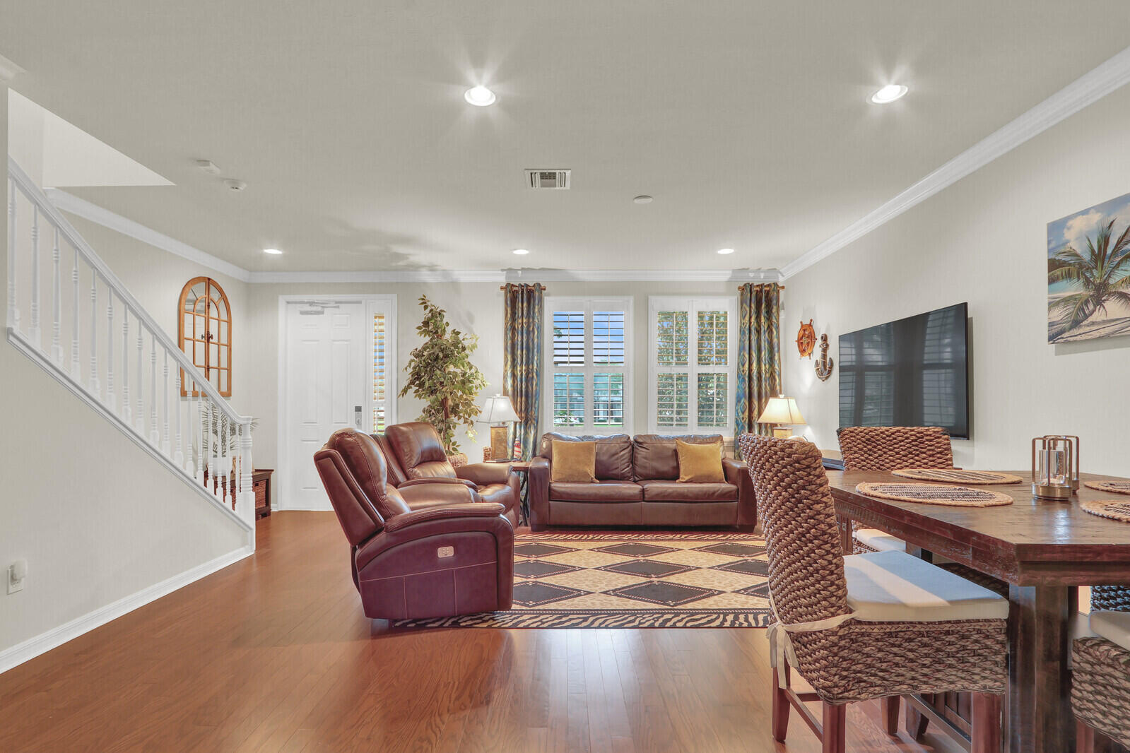 3277 East Mallory Boulevard Jupiter, FL 33458 - Photo 11 of 44 a living room with furniture and a flat screen tv