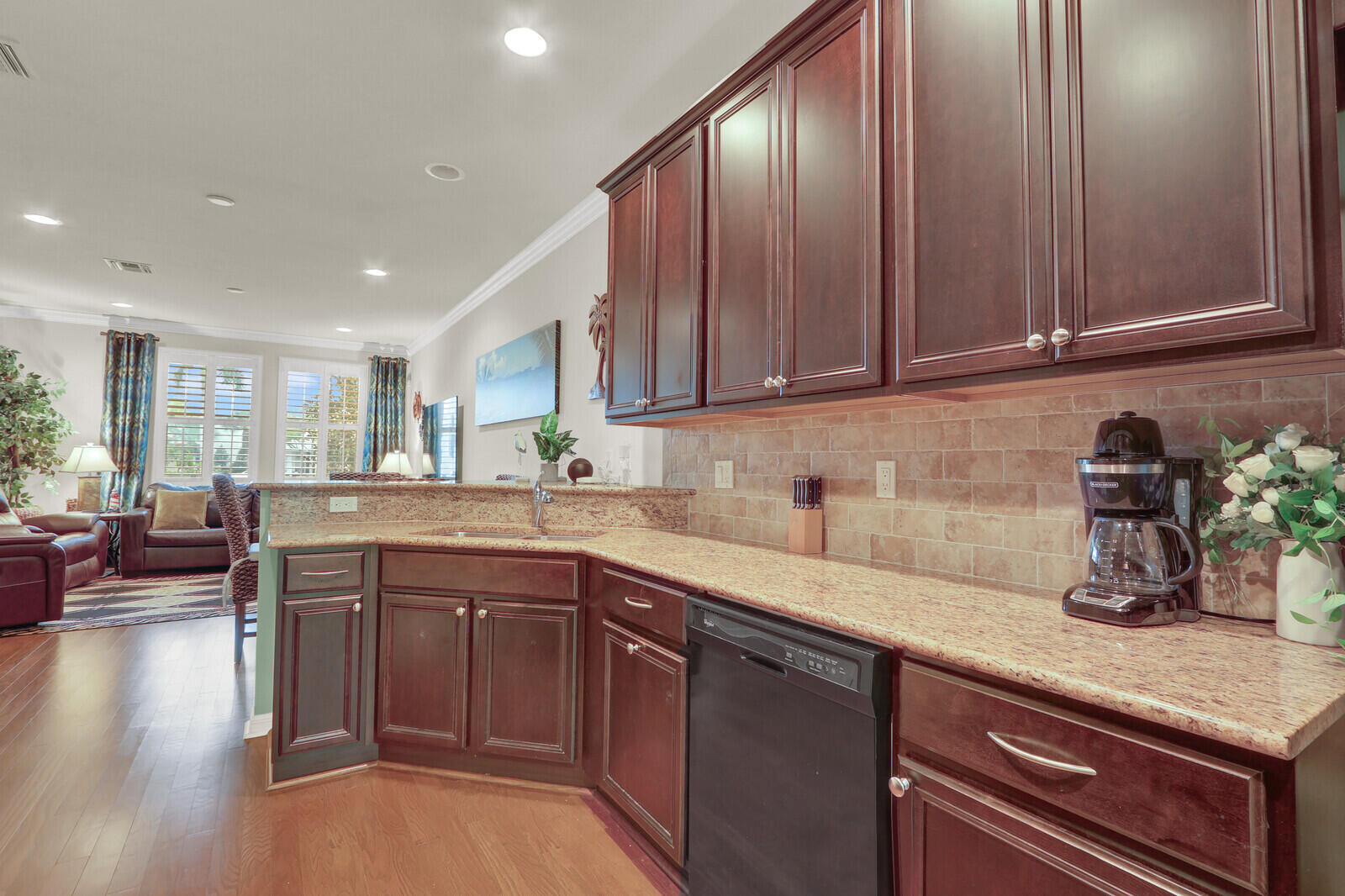 3277 East Mallory Boulevard Jupiter, FL 33458 - Photo 13 of 44 a kitchen with lots of counter top space and wooden floor