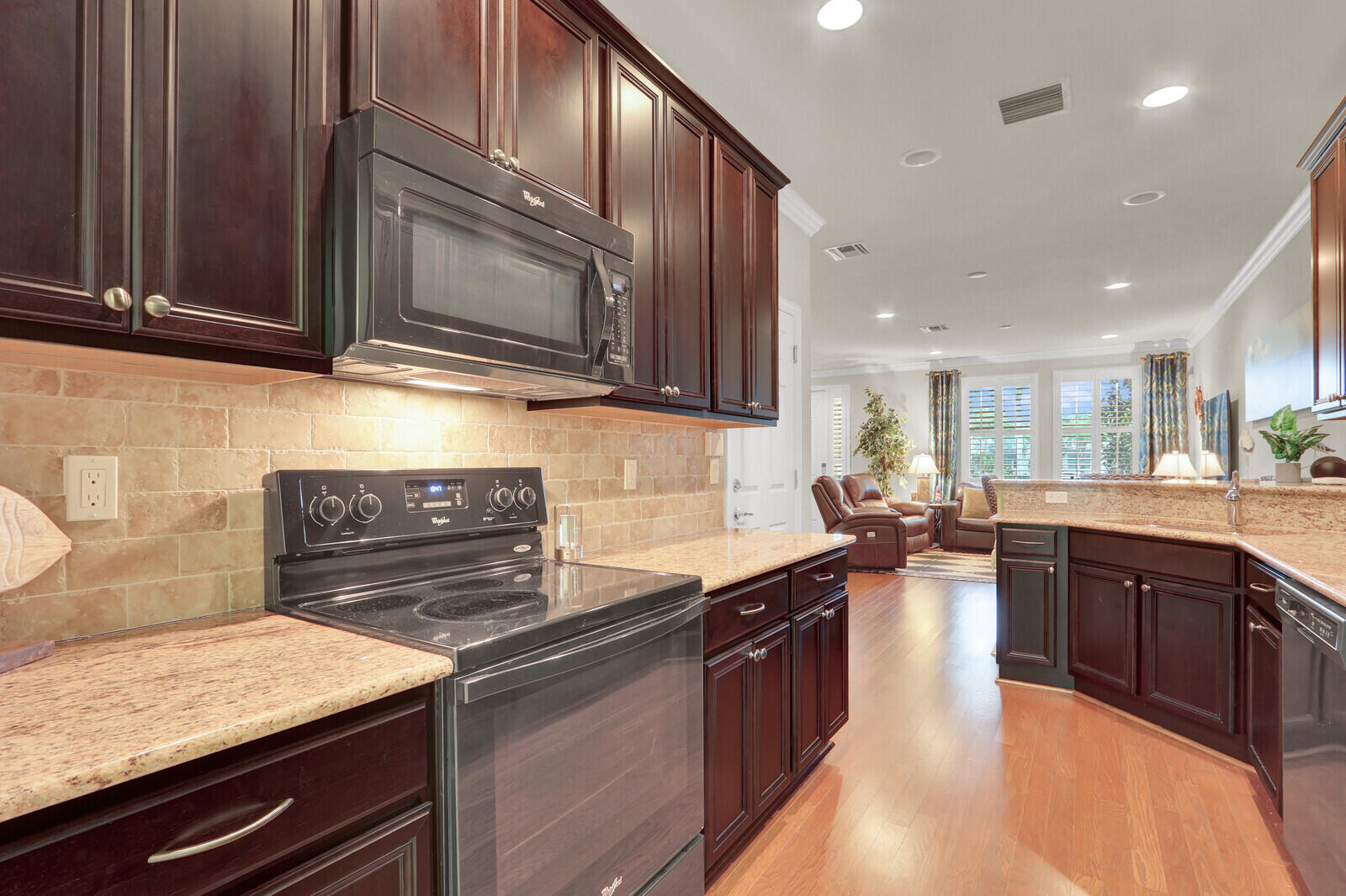 3277 East Mallory Boulevard Jupiter, FL 33458 - Photo 16 of 44 a kitchen with granite countertop stainless steel appliances and sink