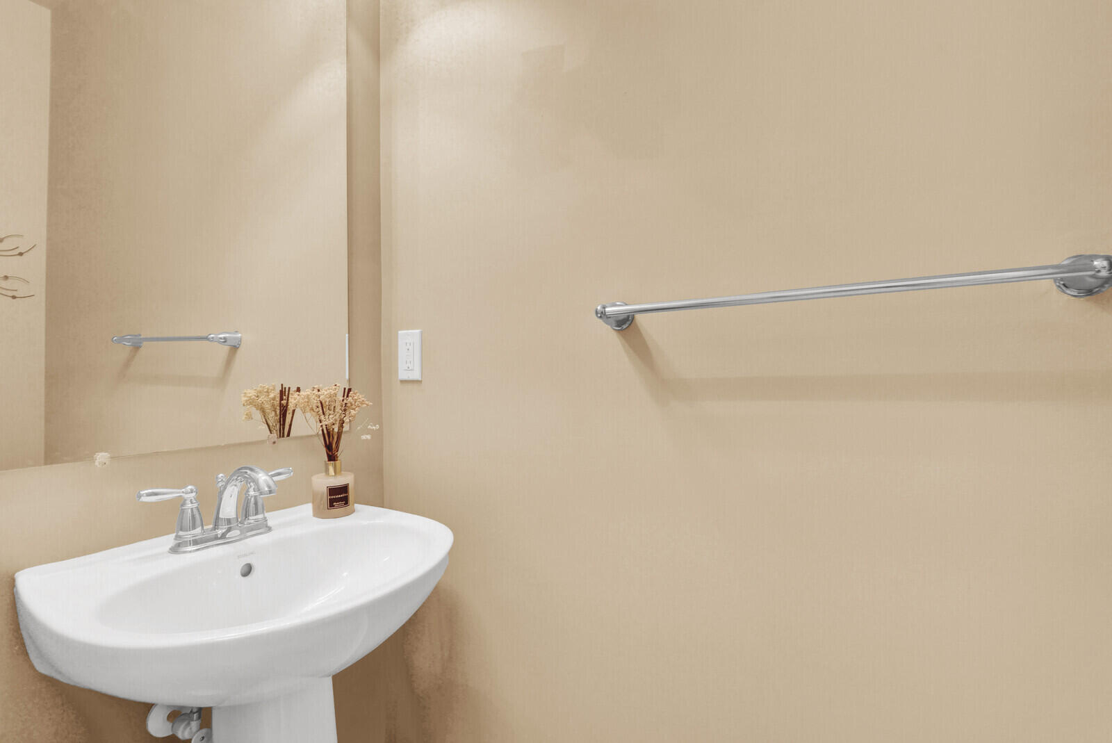 3277 East Mallory Boulevard Jupiter, FL 33458 - Photo 17 of 44 a bathroom with a sink and a mirror