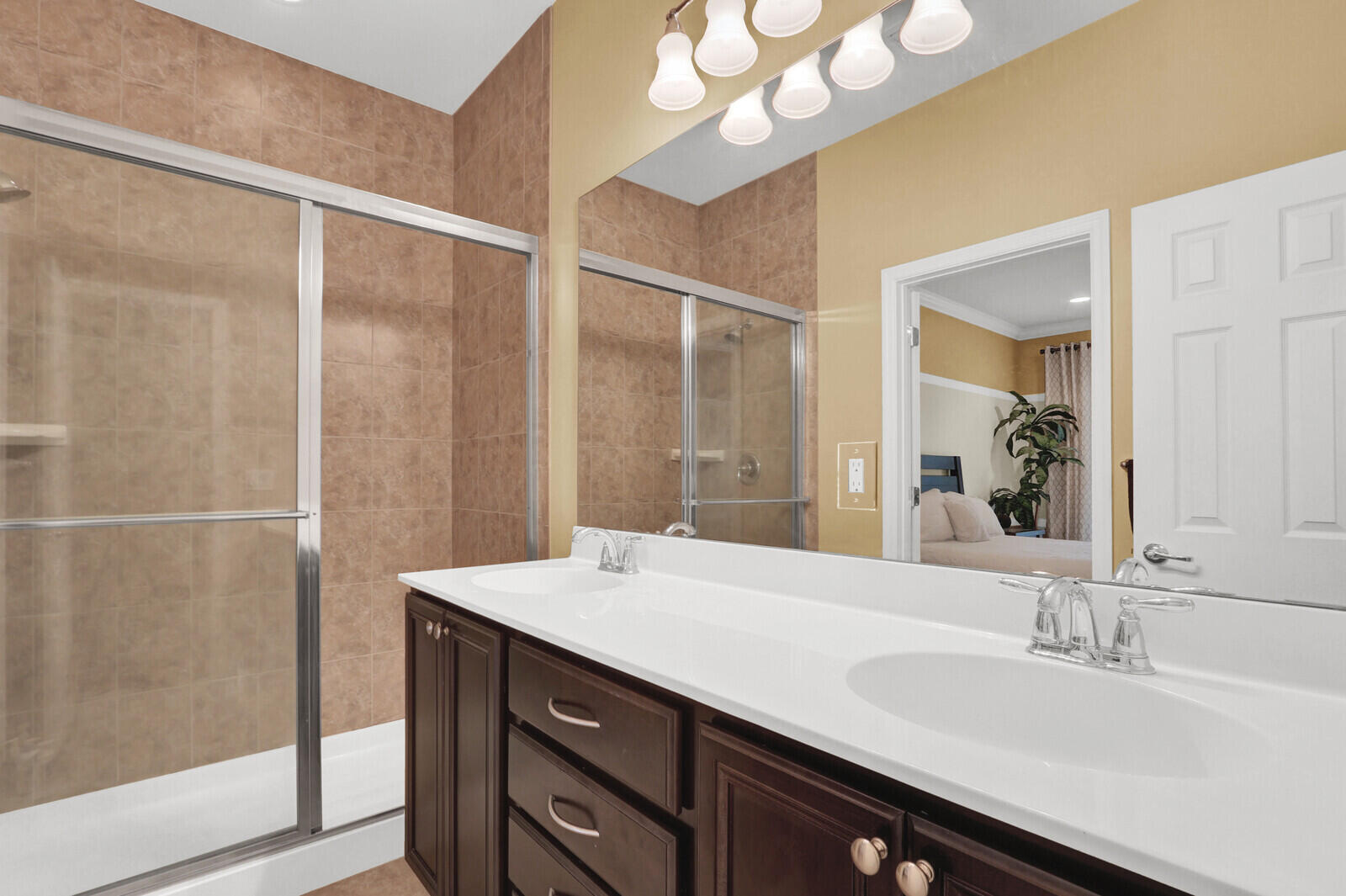 3277 East Mallory Boulevard Jupiter, FL 33458 - Photo 21 of 44 a bathroom with a double vanity sink and a mirror
